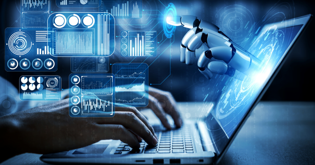 A person types on a laptop while a robotic hand assists from the laptop, showcasing the blend of human and technology in action.
